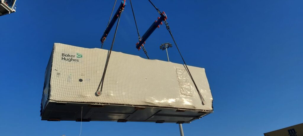 Machinery being lifted onto a vessel